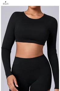 Detail of black long-sleeve crop top and high-waisted shorts set for gym and yoga