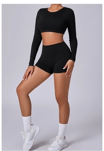 Close-up of the black slim-fit yoga set showing the seamless fabric and elastic waist