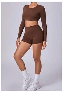 Detail of a brown long-sleeve crop top and high-waist shorts in matte elastic fabric