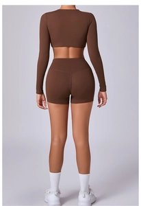 Rear view of brown long sleeve yoga top and high waist shorts with V-shaped back seam