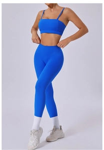 Royal blue two-piece yoga set featuring a sports bra and high-waisted leggings in studio