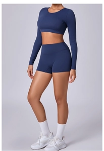 Close-up of high-elasticity navy blue long sleeve crop top and yoga shorts set