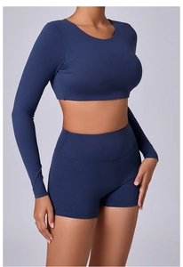 Close-up of navy long sleeve crop top and high-waist shorts in brushed yoga fabric