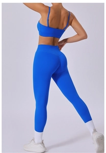 Rear view of cobalt blue high-waist yoga leggings and strappy sports bra set for women