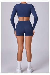 Detail showing high-waist yoga shorts with a form-fitting cut and navy blue fabric texture