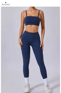 Navy blue two-piece yoga set featuring a sports bra with straps and high-waisted leggings