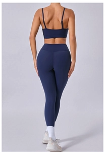 Rear view of deep blue yoga set featuring cross-back sports bra and high-waisted leggings