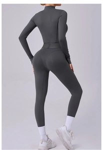 Vue arrière d'un body de yoga à manches longues gris foncé en tissu sportif de qualité