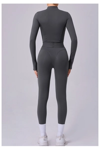 Vue arrière d'une combinaison de yoga gris anthracite à manches longues avec effet galbant