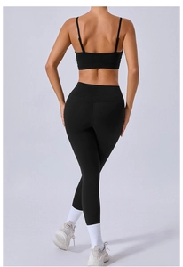 Detail of black yoga set featuring high-waisted leggings and sports bra with a slim fit back