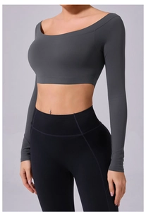 Detailed front view of women's dark grey off-shoulder cropped yoga top and black leggings