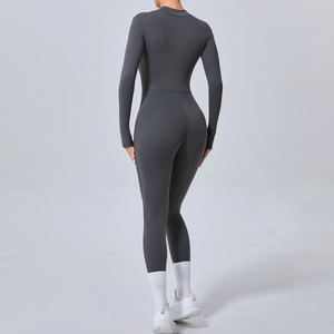 Combinaison de yoga gris foncé moulante avec manches longues et encoches pour les pouces