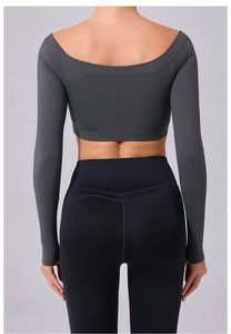 Close-up of the grey off-shoulder yoga top and high-waist leggings with V-shape seam