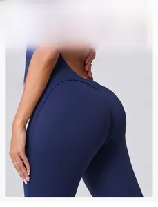 Close-up of peach lift seam design on navy blue yoga bodysuit for shaping effect