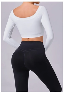Macro view of high-waist yoga pants with heart-shaped butt lift stitching and elastic fabric