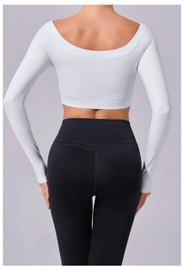 Rear view of white off-shoulder yoga top with black high-waisted fitness leggings