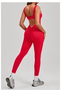 Detail of red backless yoga bodysuit featuring V-shaped scrunch butt lifting seam