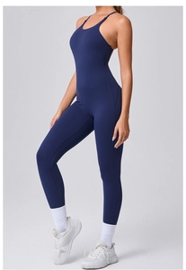 Detail of navy blue one-piece yoga jumpsuit with adjustable straps and athletic fit