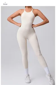 Close-up of beige yoga jumpsuit with adjustable straps and open back detail