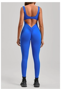 Close-up of the back view of blue backless yoga jumpsuit with ruched butt lifting detail