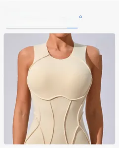 Detailed close-up of cream yoga bodysuit featuring 3D contouring seams and U-neckline