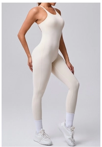 Side view of cream white sleeveless yoga jumpsuit showing slim fit and stretch fabric