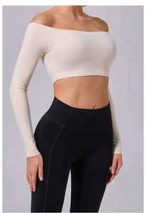 Detail of off-shoulder cropped long sleeve yoga top with high-waist fitness leggings