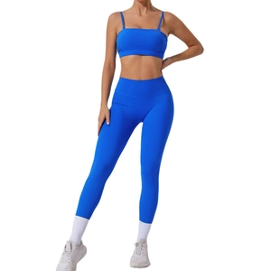 Women's bright blue yoga set with sports bra and high waisted leggings for fitness