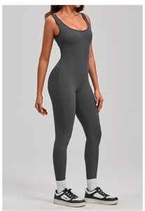 Detail view of dark grey tight-fitting yoga bodysuit with U-neck and elastic fabric