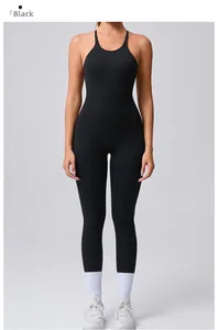 Close-up detail of black yoga jumpsuit showing slim fit fabric and adjustable straps