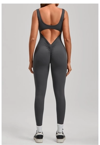 Close-up of the backless V-shaped waist and ruched booty detail on dark gray yoga bodysuit