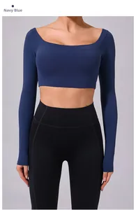 Close-up of navy blue long sleeve yoga top with square neckline and cropped slim fit