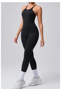 Close-up of black bodycon yoga jumpsuit featuring adjustable straps and moisture-wicking fabric