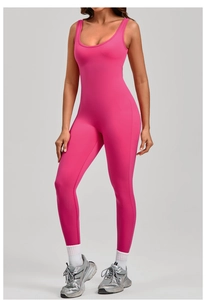 Detailed full body view of a hot pink backless yoga jumpsuit with U-neck design
