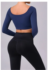 Detail view of women's backless long sleeve yoga crop top and high waist leggings