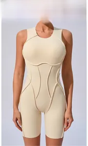 Detail of beige seamless athletic bodysuit featuring contouring compression stitch lines