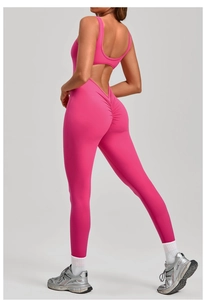 Detail of pink backless yoga bodysuit featuring scrunch butt lifting design for fitness