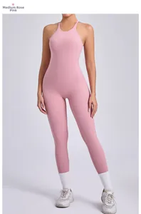 Detail of medium rose pink backless yoga jumpsuit with adjustable straps and scrunch butt