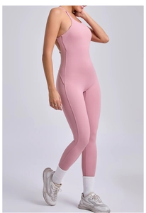 Detail showing the adjustable straps and backless design of the pink yoga jumpsuit