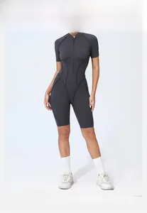 Detail of grey athletic short sleeve yoga romper with front zipper and ergonomic seams