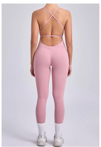 Back view of light pink backless yoga bodysuit with cross straps and high elasticity