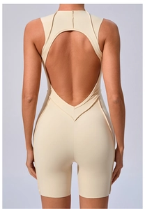 Close-up of the back cutout and V-shaped stitching on this beige yoga jumpsuit
