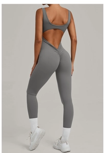 Detail of grey backless yoga jumpsuit featuring ruched bum and open back cutout design