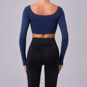 Women's off-shoulder yoga set with navy long sleeve crop top and black high waist leggings