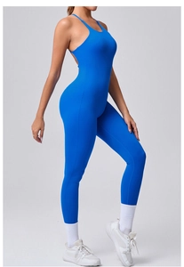 Detail view of electric blue yoga jumpsuit featuring open back and adjustable thin straps