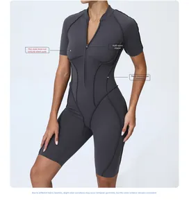 Detail of half-zip collar and body-shaping seams on grey short sleeve sports bodysuit