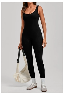Close-up of black sleeveless yoga jumpsuit in high-elastic knit fabric with slim fit