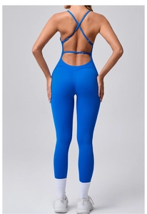 Detail of cross back straps and buckle on blue high-elastic fitness bodysuit