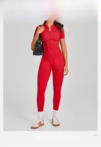 Close-up of red high-elasticity yoga bodysuit with stand collar and zipper detail