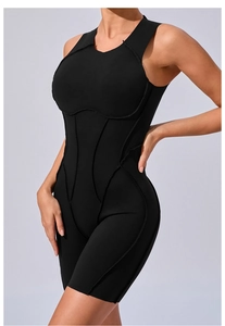 Macro view of the structural external stitching on this black athletic yoga bodysuit